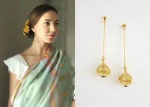 Elegant, stylish, gold plated long earrings with filigree work and garnet accent
