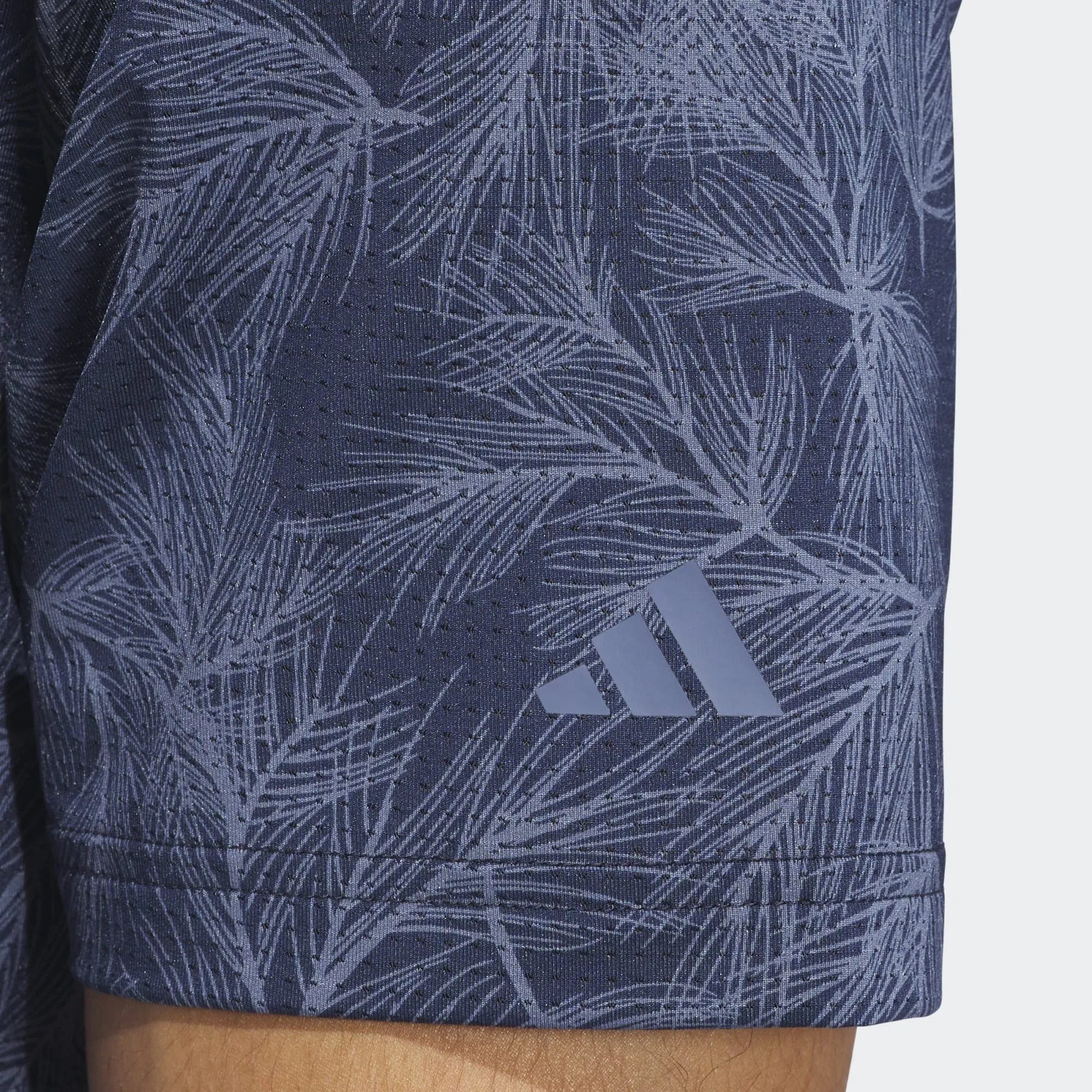 Polo de golf con estampado de malla de adidas